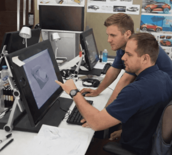 The designer focuses on modeling vehicle parts